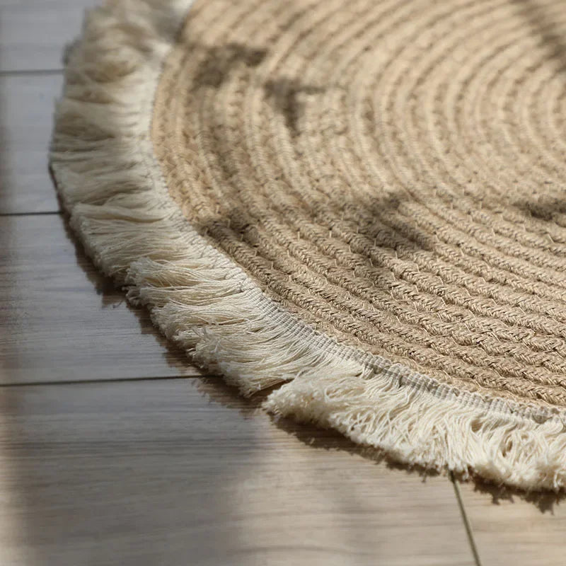 Tapis rond tressé à franges aspect jute